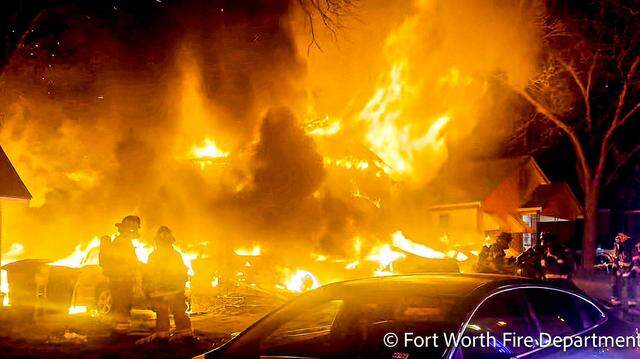 Fort Worth firefighters battled a blaze that displaced seven people, including a child, early Wednesday, March 25. The fire also caused moderate damage to a neighboring house.